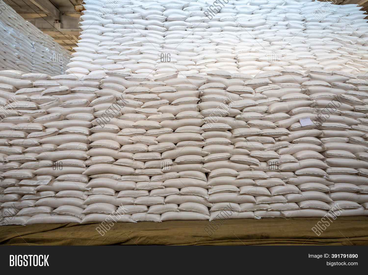 Stacked sugar bags in warehouse